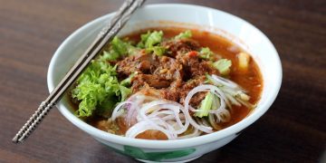 Penang Laksa and Char Kway Teow: Iconic Flavors of Penang’s Culinary Heritage